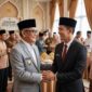 Ilustrasi foto AI silaturahmi Buapti PALI, Asgianto dengan mantan Bupati PALI, Heri Amalindo, pada momen Idul Fitri 1447 H. (Dok/tintamerah)