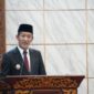 Bupati PALI, Asgianto, menyampaikan Nota Pengantar LKPJ TA 2025 dalam Rapat Paripurna DPRD, [Tanggal]. Dalam pidatonya, ia menegaskan 13 Program Unggulan 2025-2029 yang berfokus pada kemandirian desa, penguatan SDM, dan percepatan infrastruktur dasar demi mewujudkan masyarakat PALI yang lebih mandiri dan modern. (Foto: Dok/Kominfostaper PALI)  